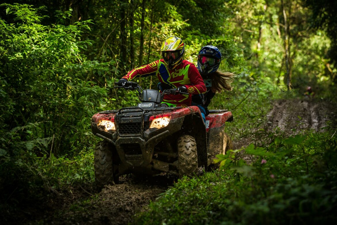 Photo by Elievan Junior man and woman riding on ATV
