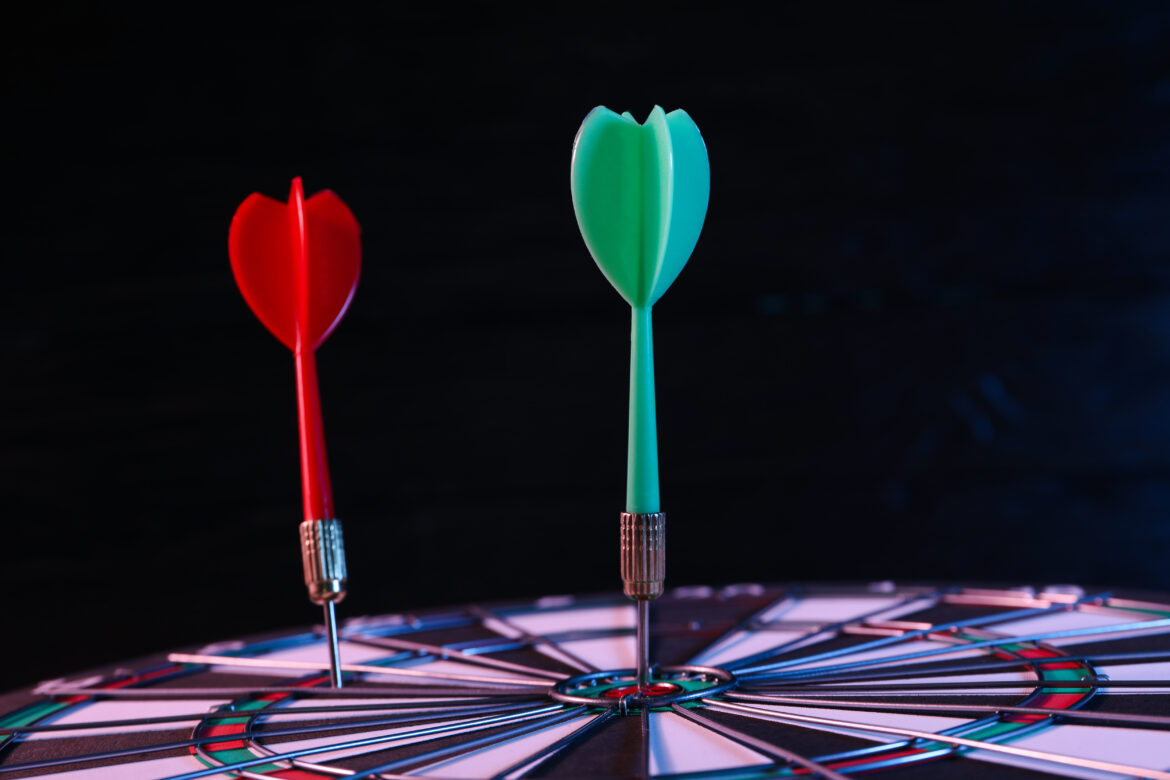 Dart board with wires, on a black background Pikado